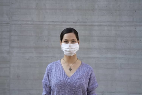 Woman wears medical mask