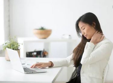 Woman feeling neck pain