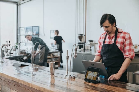 Two men working in a coffee shop